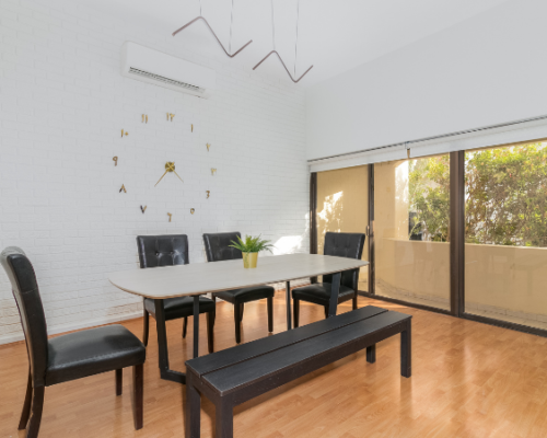 dining table available in lounge in holiday homes in dubai
