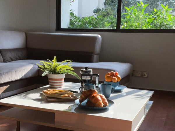 a room with sunlight in a seating room in holiday villas in dubai for family vacation and business meetings